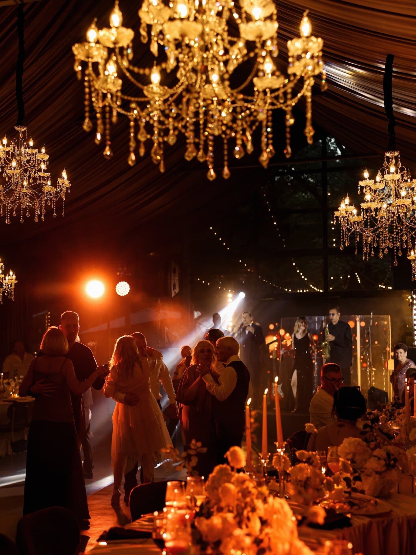 A candlelit reception in warm tungsten light